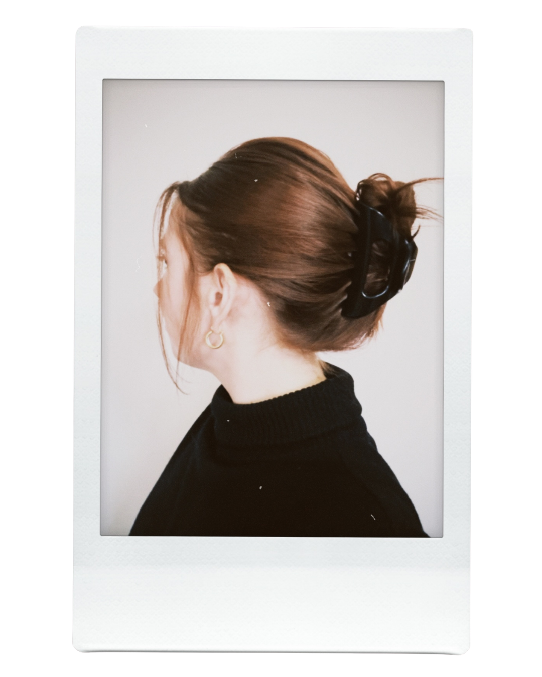 Side view of a woman wearing a black cozy clip